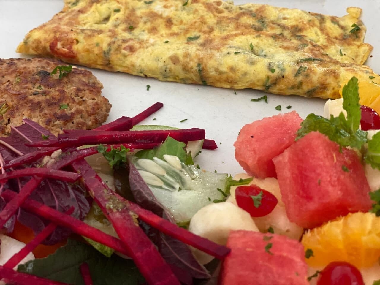 Omelette with fresh fruit and beetroot salad