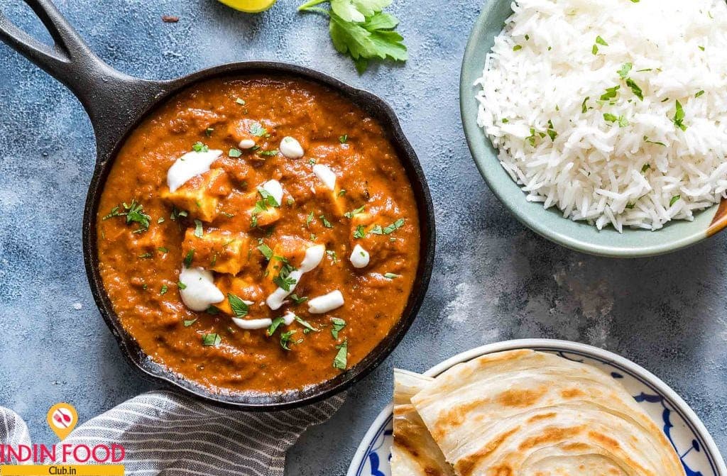 Butter masala curry with rice and naan