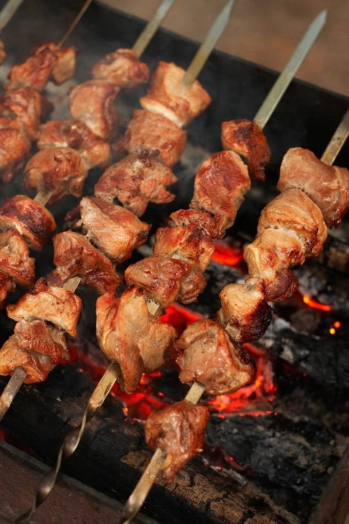Meat skewers over the coals