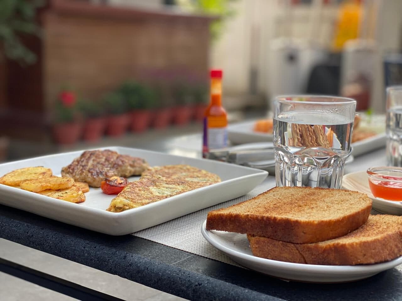 Breakfast with toast served on the terrace